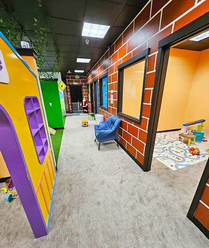Hallway showing different playrooms